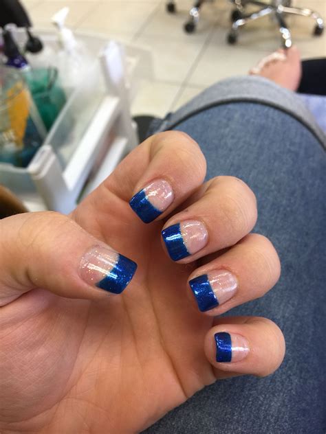 blue french tip acrylic nails.